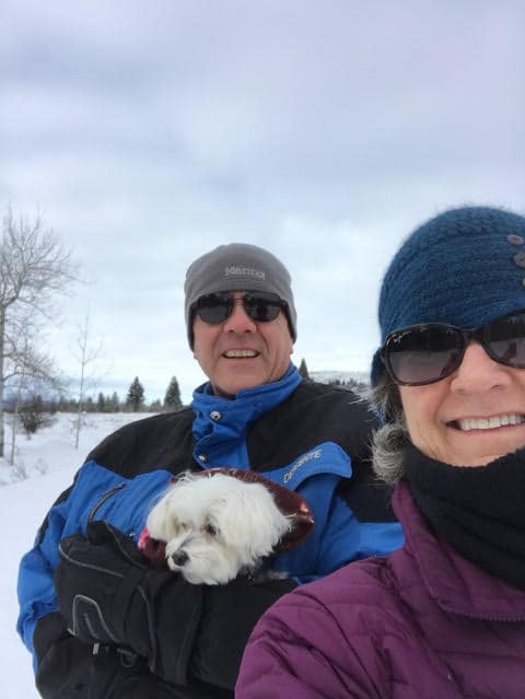 Maltese and Owners in the Snow