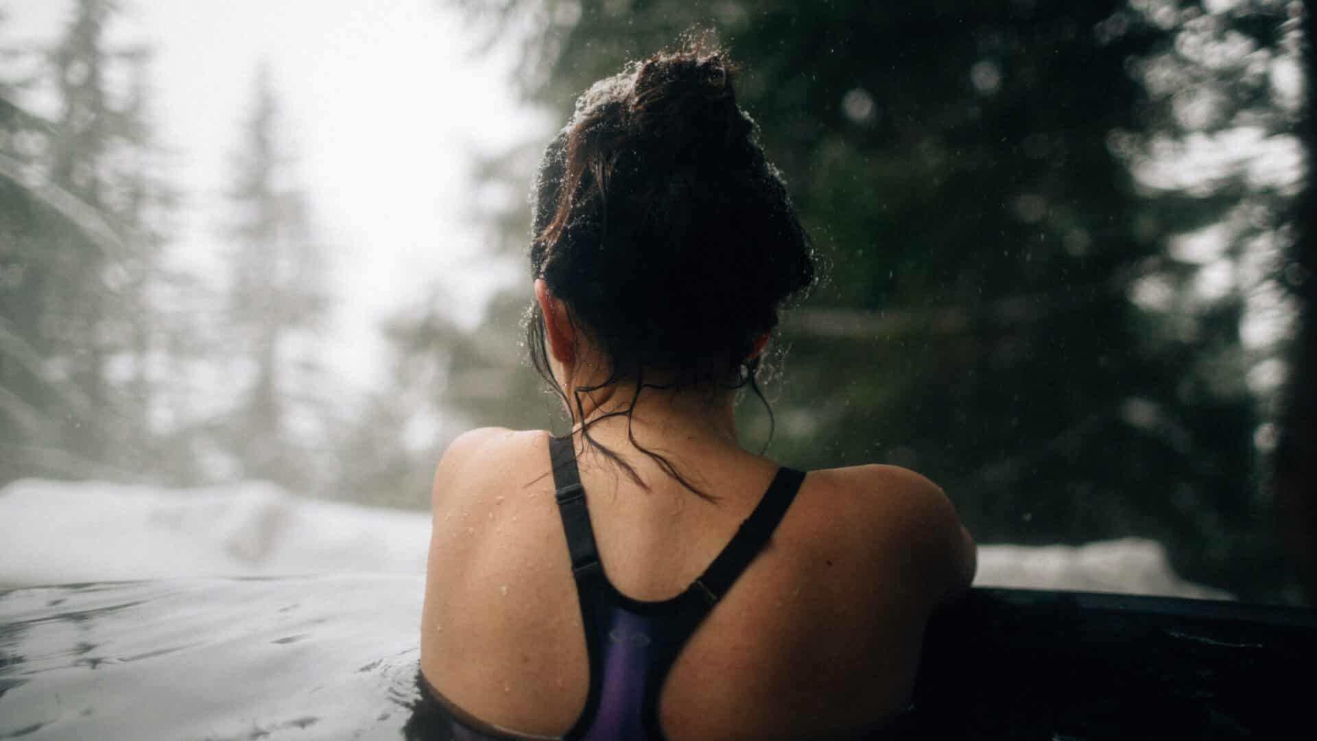 Woman soaks in hot springs