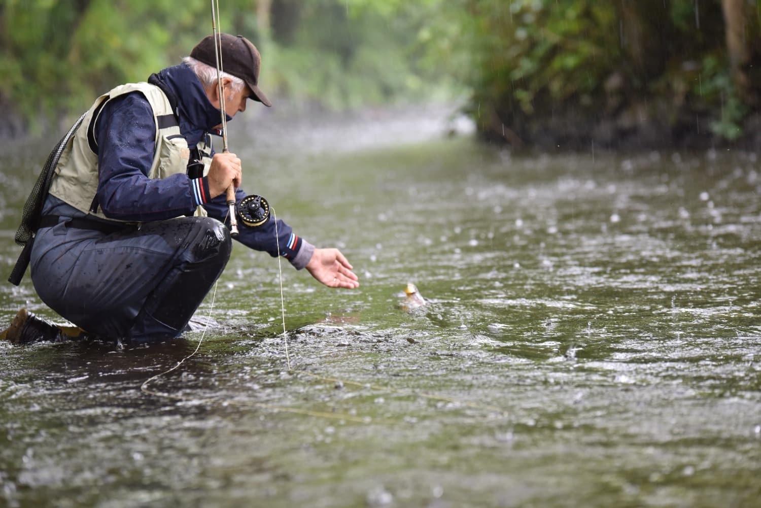 older man flyfishing WIIN